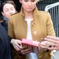 Jennifer Lawrence signing a box of Cheez-Its