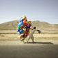 Afghan Man Carries Balloons Alongside A Road Near Kabul